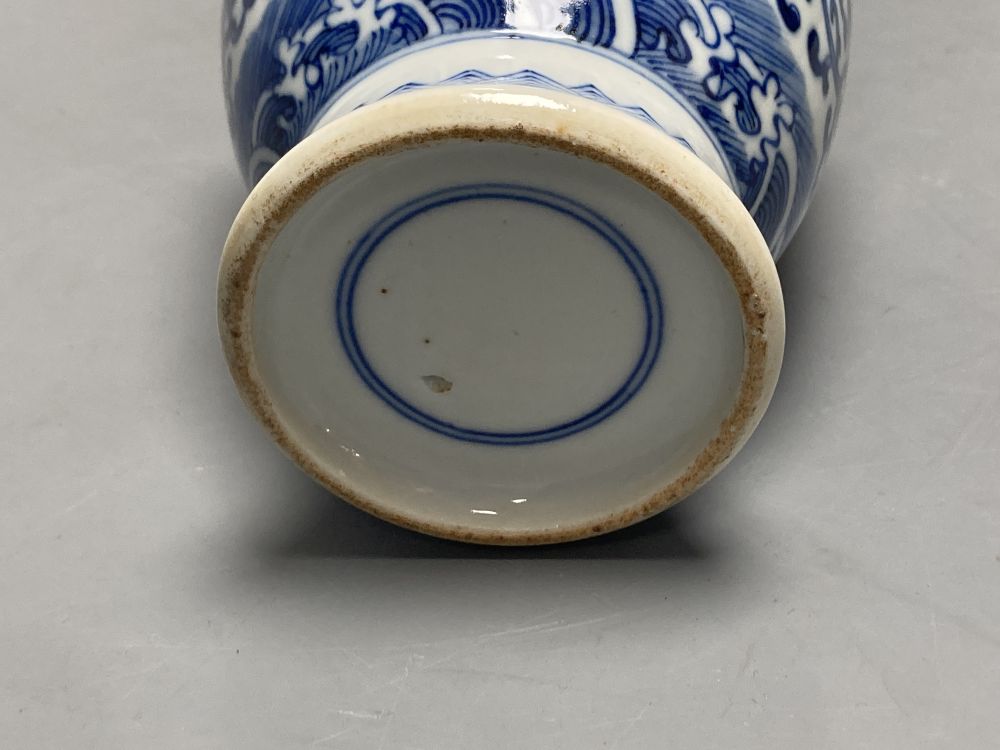 A Chinese blue and white dragon design vase, height 25cm
